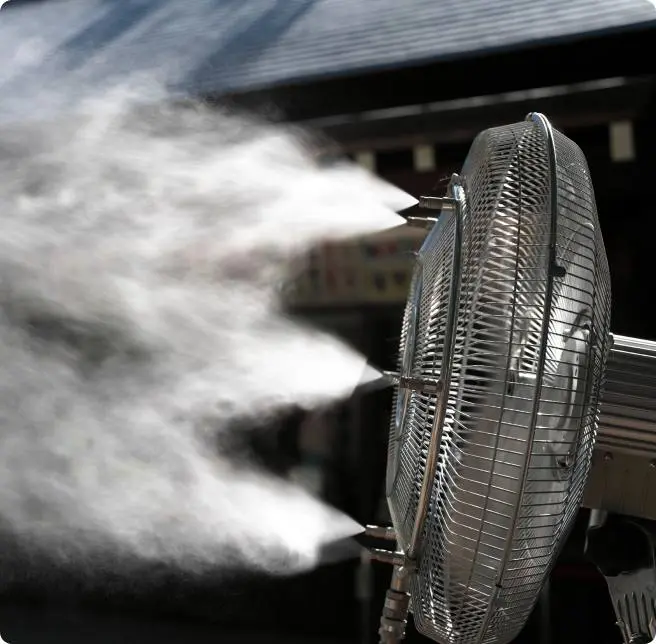 Misting fan for outdoor cooling